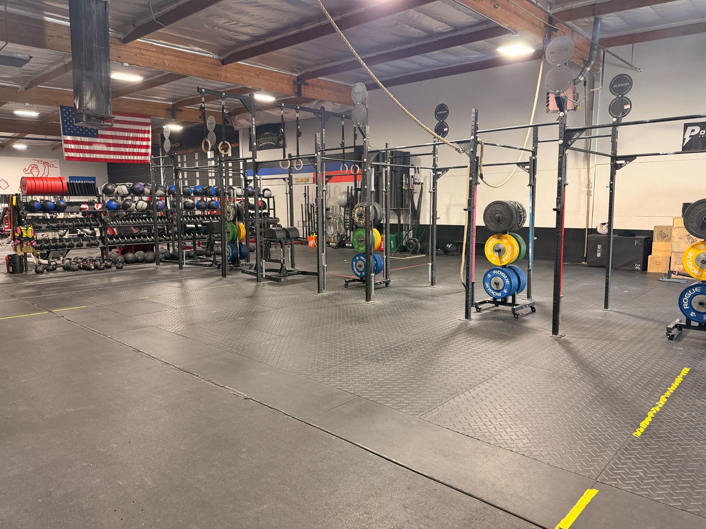 The PowerSource lifting floor: squat racks, bumper plates, dumbbell and medicine ball racks.